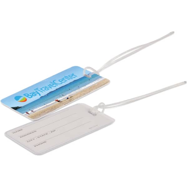 A blue luggage tag featuring a beach scene on one side and a blank information section on the reverse.