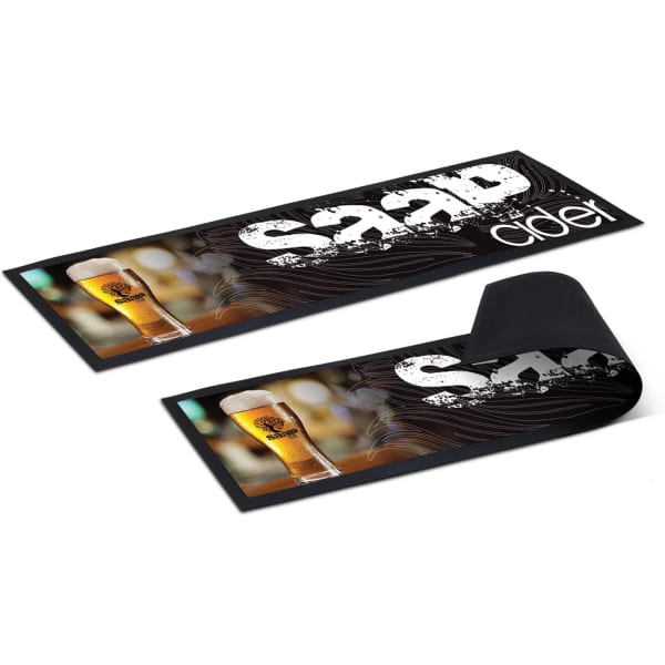 A large black counter mat featuring a beverage graphic and a logo, designed for promotional use.