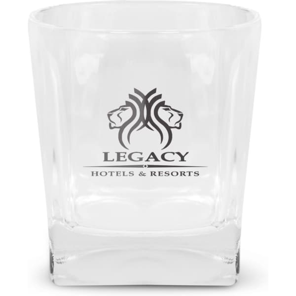 A clear glass tumbler with a logo featuring two lion heads, designed for hotels and resorts.