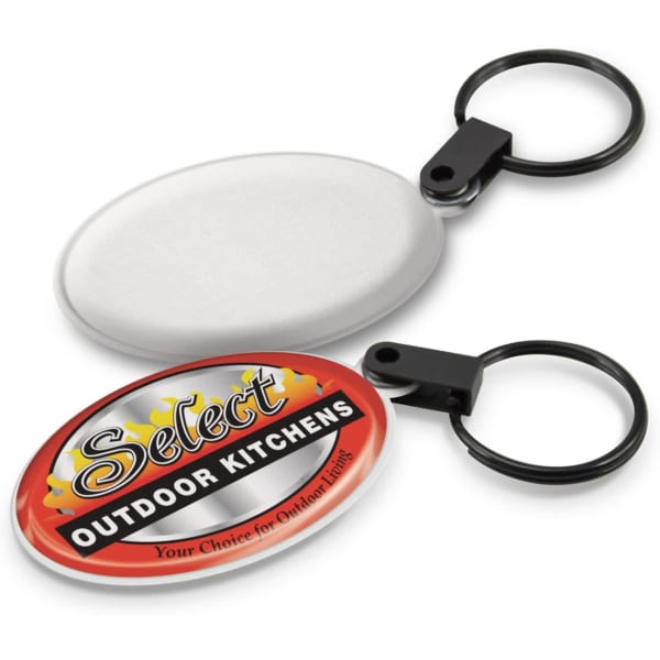 A key ring featuring a round screen cleaner with a black attachment and an oval promotional tag.