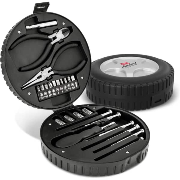 A circular black tool kit resembling a tyre, containing various tools including pliers and screwdriver bits.