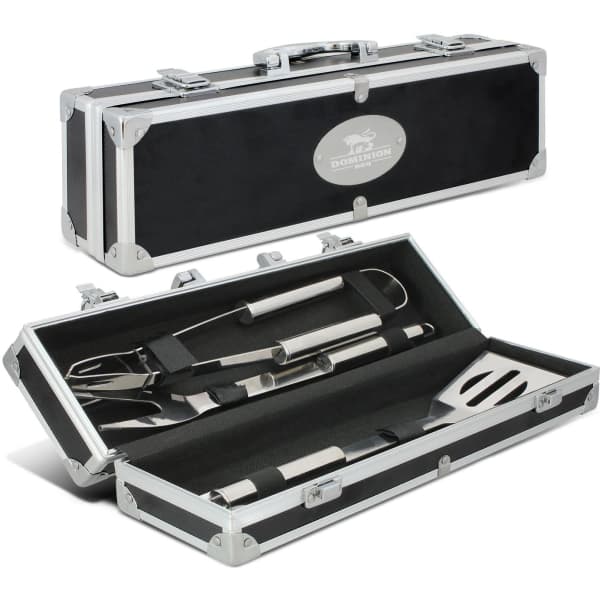 A black BBQ set with stainless steel utensils housed in a rectangular, silver-accented carry case, featuring a logo.