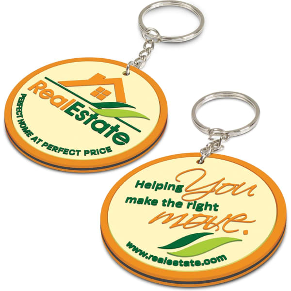 A dual-sided PVC key ring in yellow and orange, featuring a logo and promotional text.