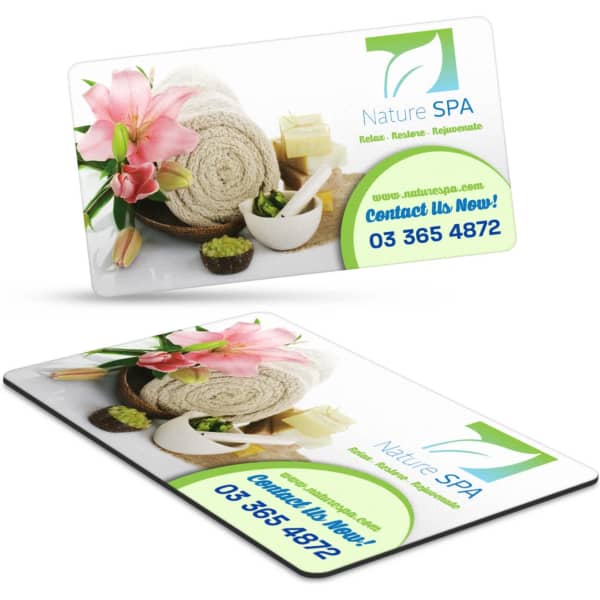 A rectangular fridge magnet featuring a floral design with a spa theme, displaying a logo and contact information.