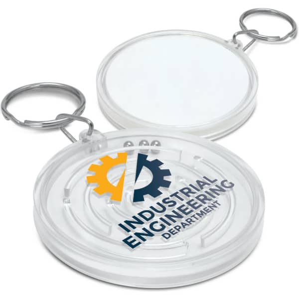 A clear puzzle key ring featuring a circular design and a keyring attachment. It includes a logo on one side.