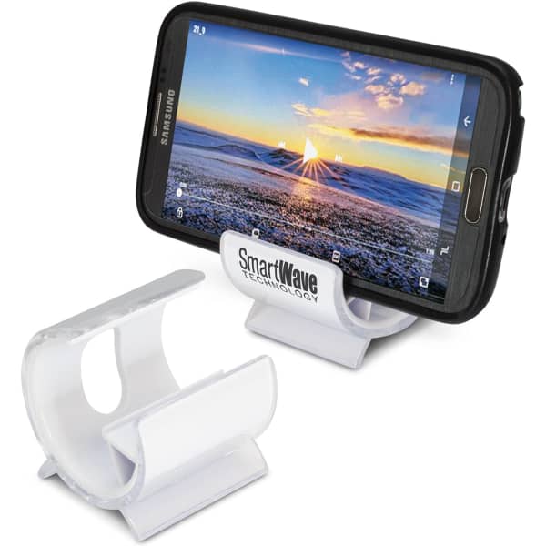 A white phone stand is displayed, supporting a smartphone with a scenic sunset background on the screen.