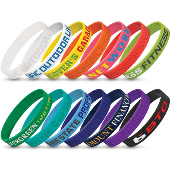 A collection of silicone wristbands in various colours, featuring debossed text and a logo on some bands.