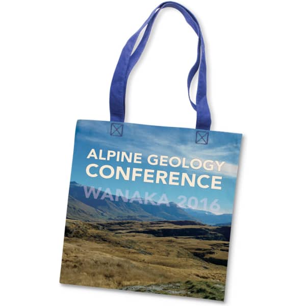 A tote bag in blue, featuring a scenic landscape print and a logo, with two handles for carrying.