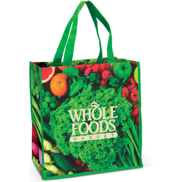 A green tote bag featuring a variety of fruits and vegetables with a logo on one side.