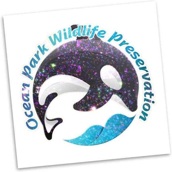 A square temporary tattoo featuring a glittery black and blue whale design with multicoloured sparkles.