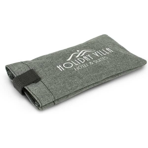 A green sunglass pouch with a fold-over design and an elastic strap, featuring a logo on the front.