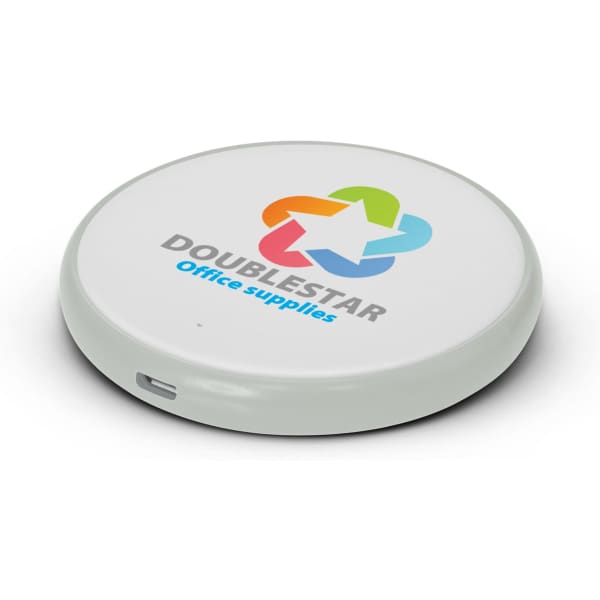 A round wireless charger in white with a green base and a multi-coloured logo on top.