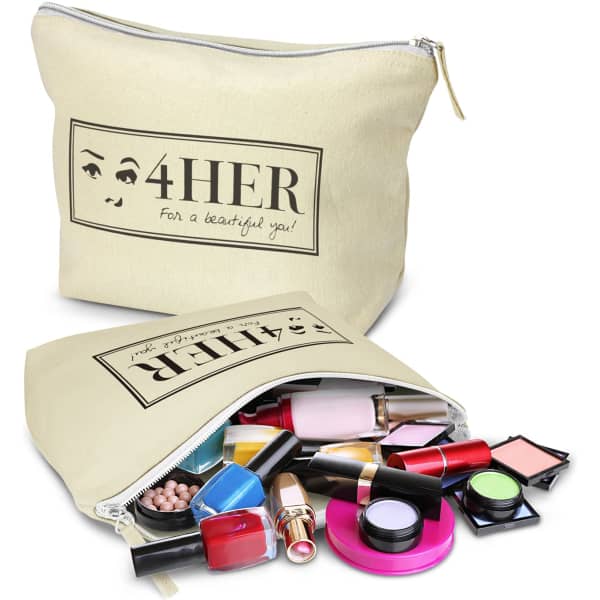 A large cream cosmetic bag with various makeup products spilling out, including lipsticks, eyeshadows, and brushes.