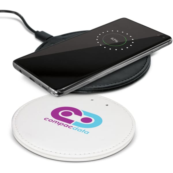 A wireless charger in white with a circular design, featuring a logo, and a smartphone placed on top, showing charging status.