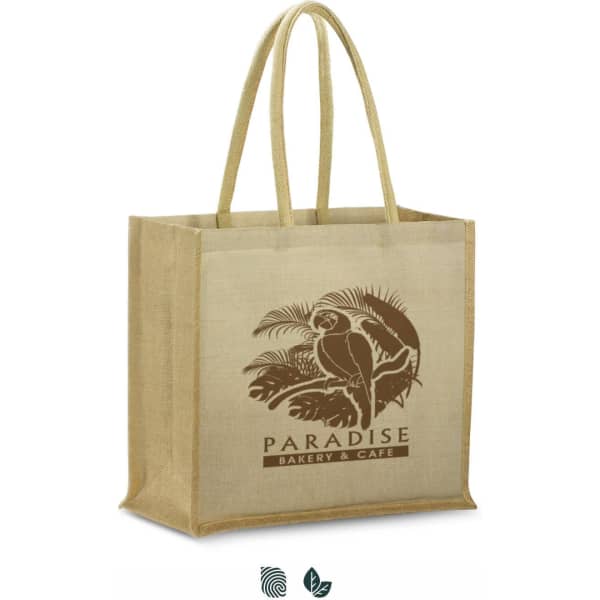 A tan Juco tote bag with sturdy handles and a logo featuring a parrot and tropical design.