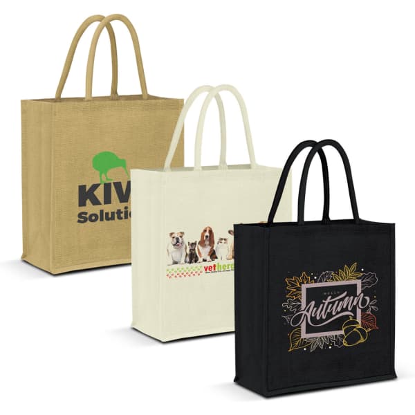 Three jute tote bags in beige, cream, and black, featuring a logo and colourful designs. Each bag has sturdy handles.
