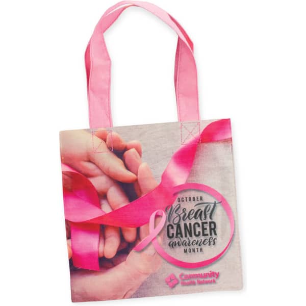 A cotton gift bag featuring a pink design and handles, with a logo and awareness messaging.