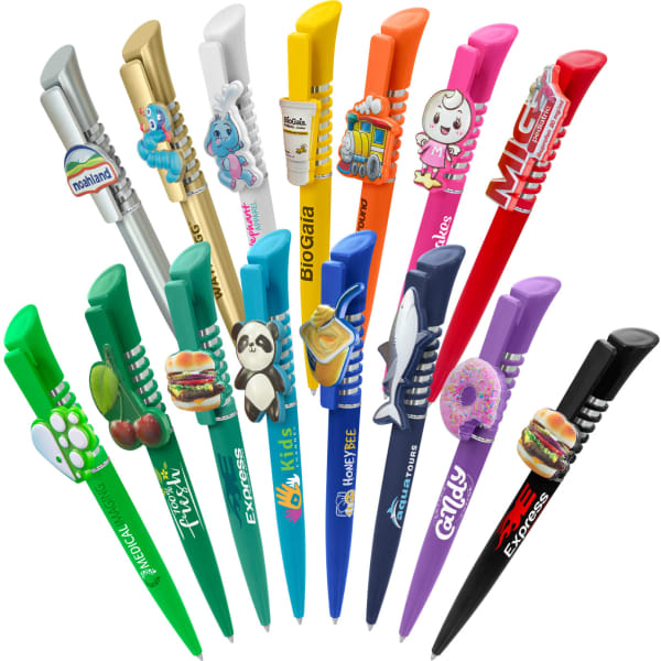 A collection of colourful plastic pens in various designs, including animal and food themes, some featuring logos.