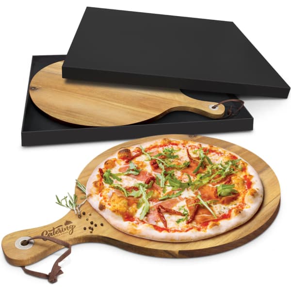 A wooden serving board in a natural finish with a handle, featuring a pizza topped with various ingredients and a black box.