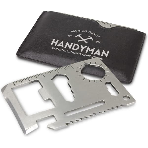A multi-tool card made of silver metal, displayed with a black card holder featuring a logo.