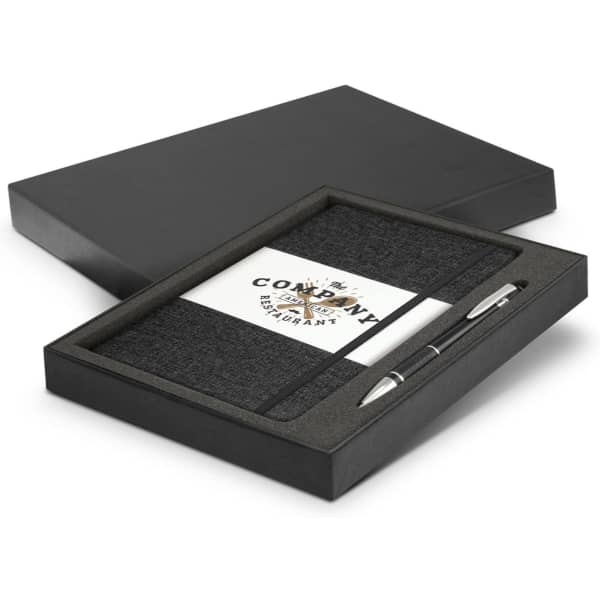 A gift set featuring a black notebook and silver pen housed in a black presentation box, complete with a logo.