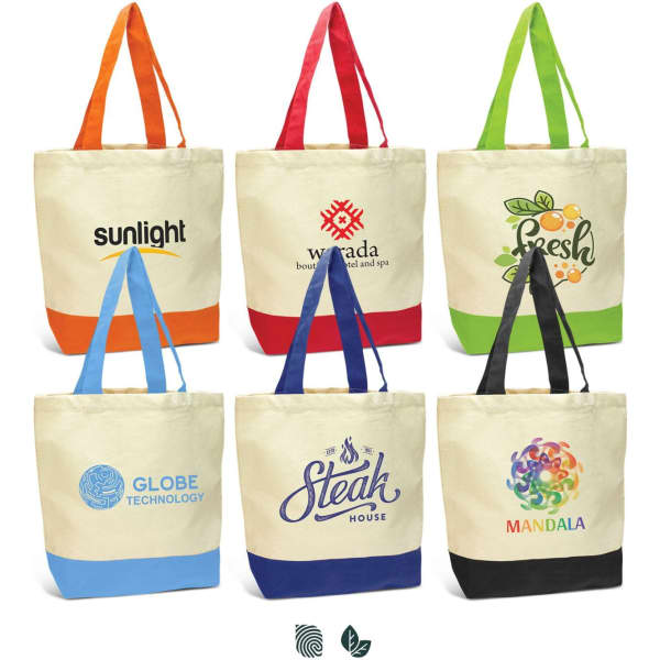 A collection of seven canvas tote bags in various colours, each featuring a different logo or design.