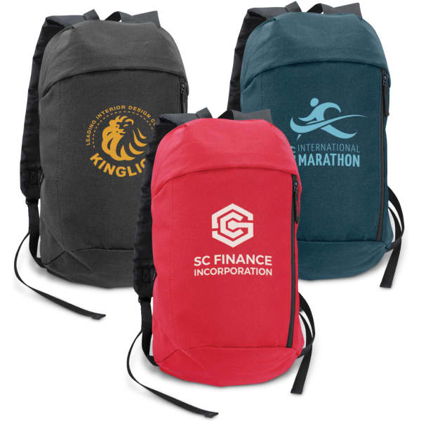 Three compact backpacks in grey, teal, and red, each featuring a logo on the front.