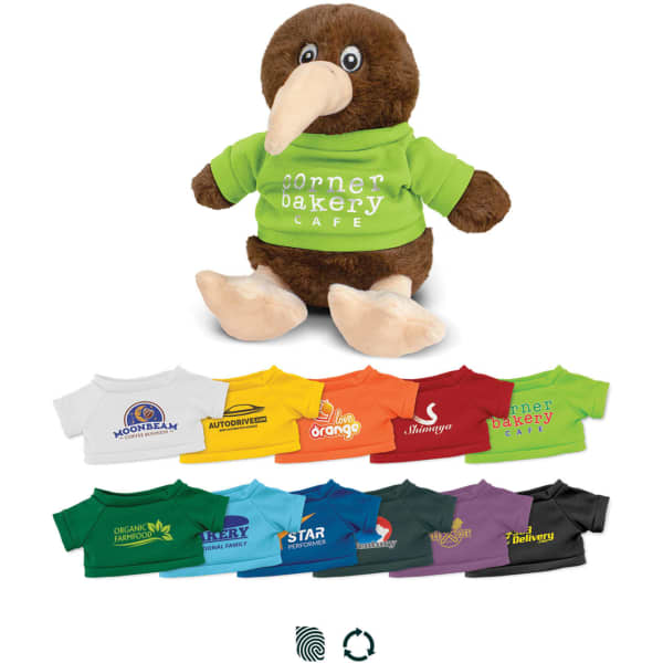 A brown kiwi plush toy wearing a green shirt, surrounded by various coloured t-shirts featuring logos.