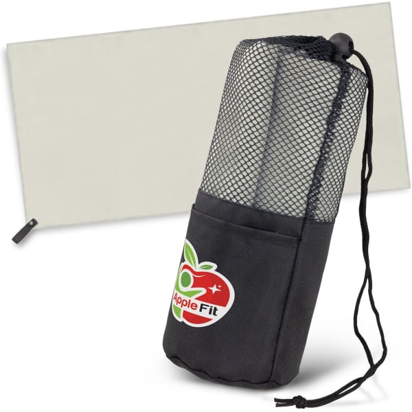 A grey beach towel neatly rolled and stored in a black mesh pouch with a pocket. The pouch has a logo.