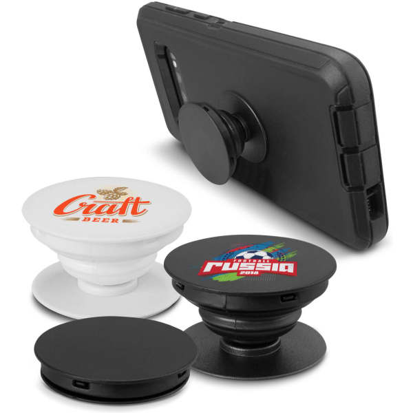 A collection of black and white phone grips, displayed with a mobile phone behind them. Each grip has a different design.