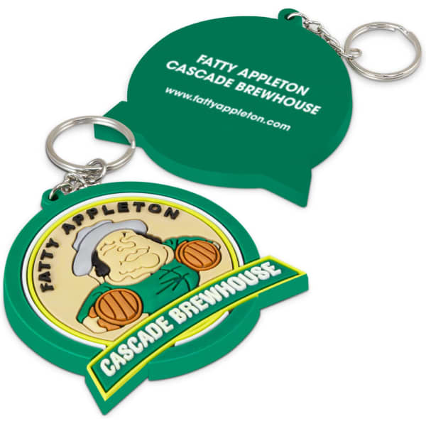 A green, moulded PVC key ring featuring a cartoonish character and a logo, attached to a metal keychain.