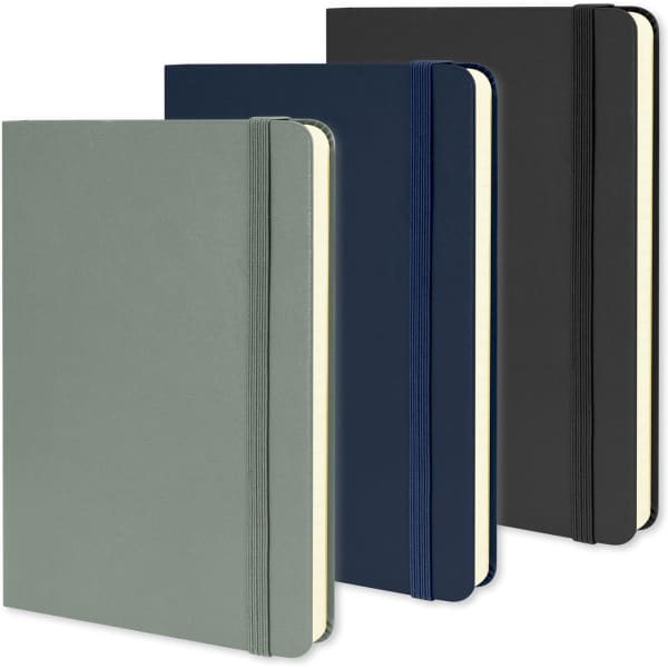 A set of three Moleskine medium hardcover notebooks in green, navy, and black, featuring elastic closures and a logo.