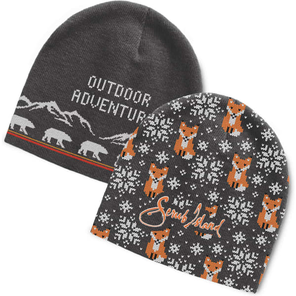 A custom knitted beanie featuring a grey mountain design and a pattern of orange foxes against a darker background.