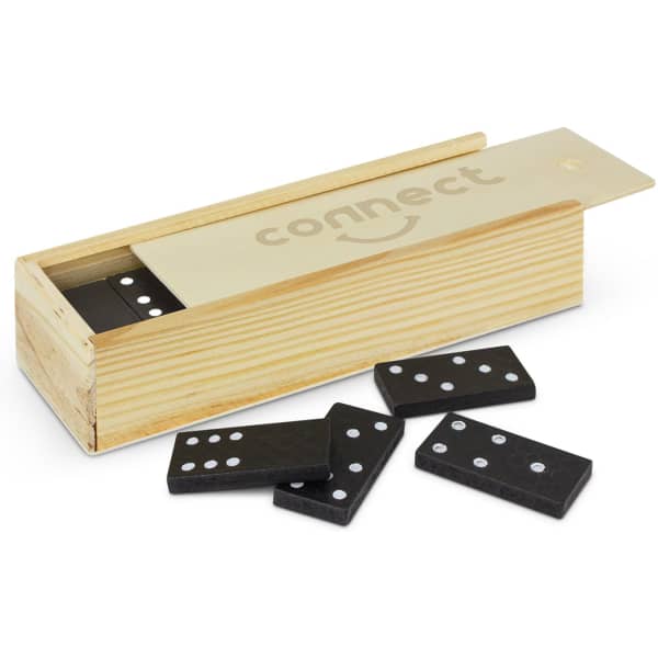 A wooden box containing black dominoes with white dots, some pieces placed beside the box. The box features a logo.