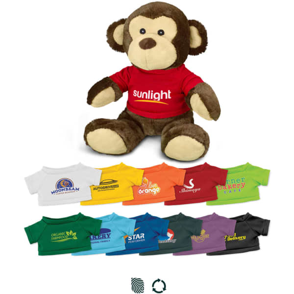 A plush monkey toy with a brown body and a red shirt, surrounded by small shirts in various colours.