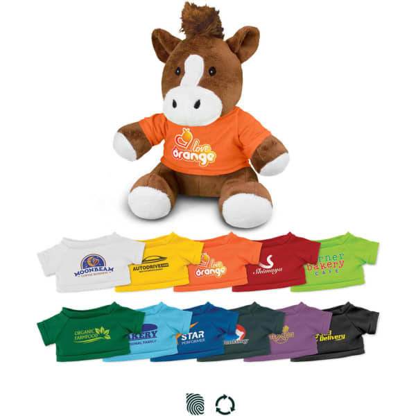 A plush horse toy in brown with a white face and a colourful orange t-shirt, surrounded by various mini t-shirts in different colours.