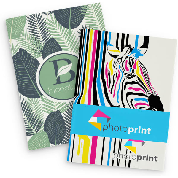 A large notebook with a leafy green cover and a brightly coloured zebra design, featuring a logo.