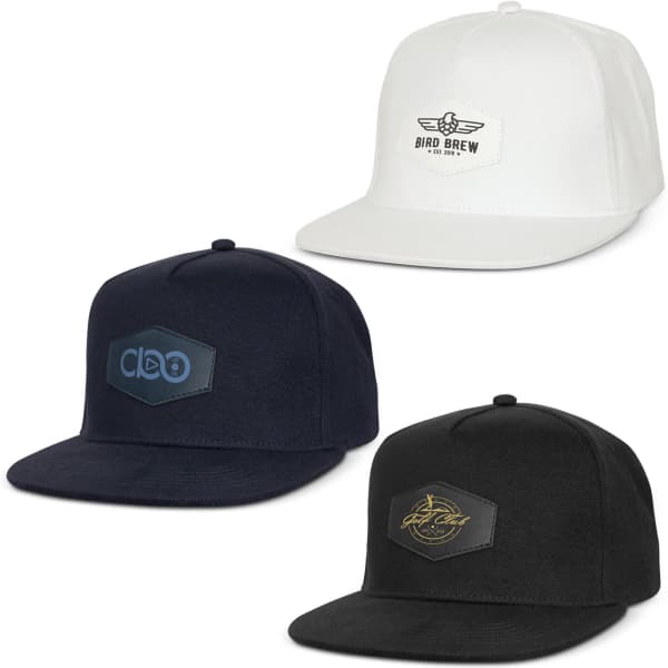 Three caps in white, navy, and black, each featuring distinct patches and logos on the front.