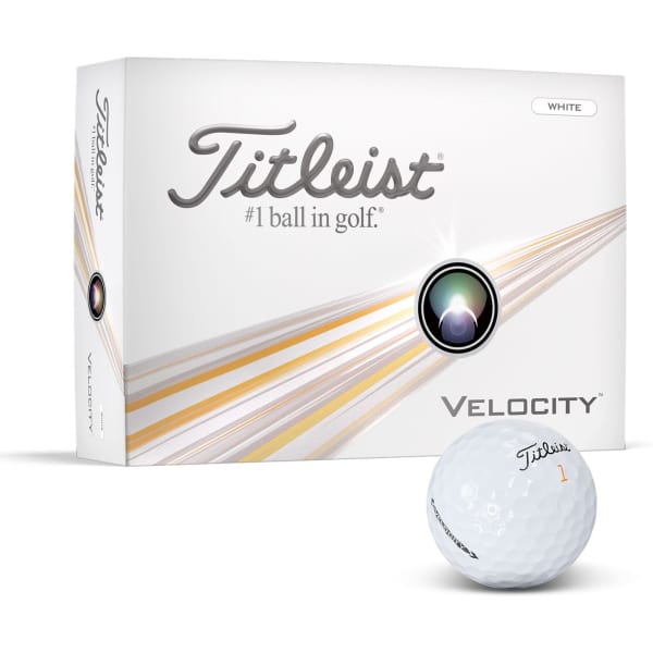 A white golf ball with a logo, next to a box of Titleist Velocity golf balls featuring colours of white and silver.