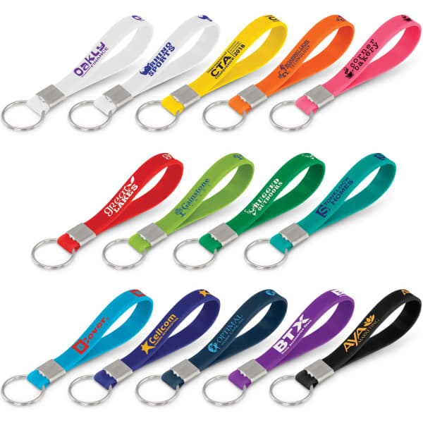 A collection of silicone key rings in various colours, each with a metal keyring attachment, featuring logos.