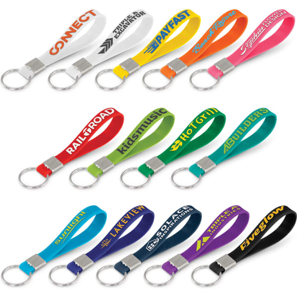 A collection of silicone key rings in various colours, featuring embossed designs and attached metal key rings.