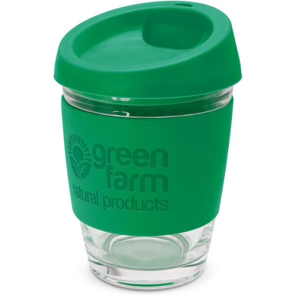A drink bottle featuring a transparent glass body and a green silicone lid and sleeve, with a logo.