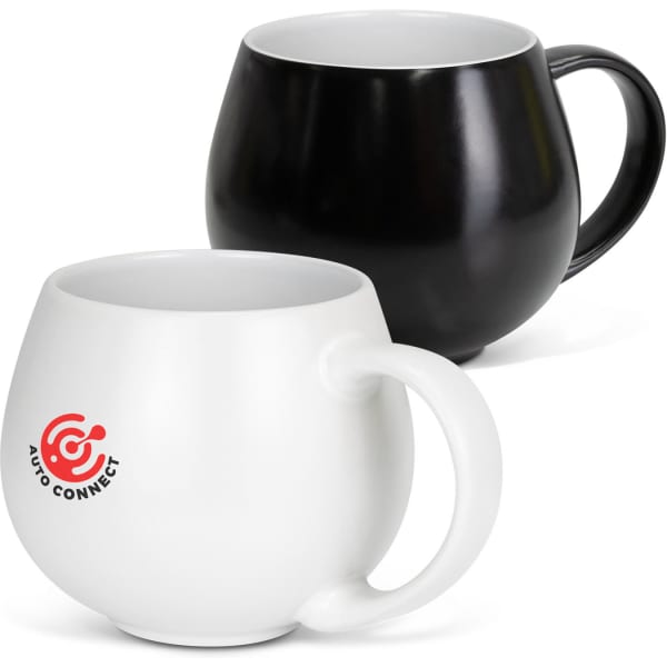 A coffee mug set featuring a black mug and a white mug with a logo on the front of the white mug.