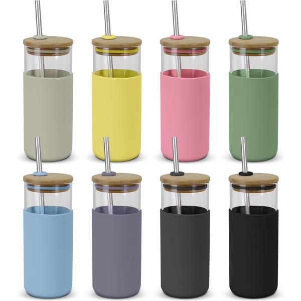 A collection of Alchemy Glass Tumblers in various colours, featuring glass bodies, bamboo lids, and stainless steel straws.