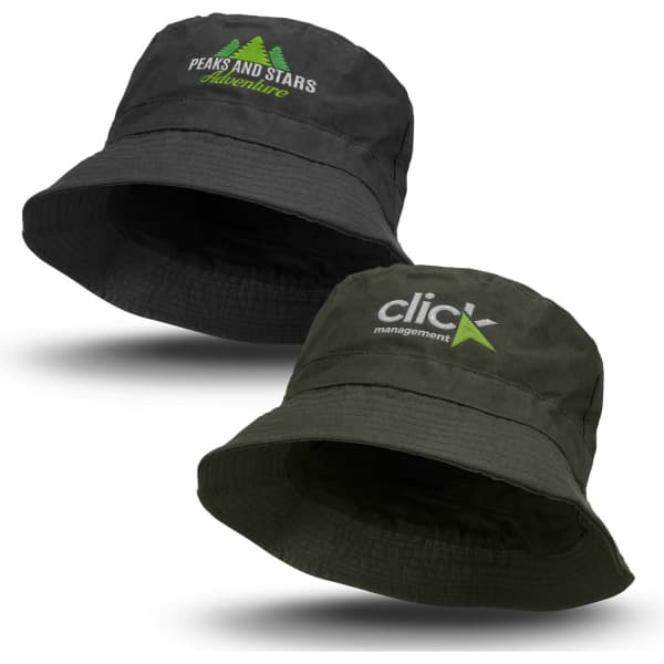 A black and dark green oilskin bucket hat with logos on the front. The hats feature a wide brim for sun protection.