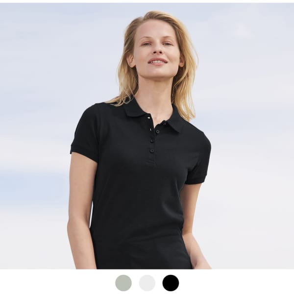 A woman wearing a black polo shirt with a collar, presented against a light background. The shirt has a logo.