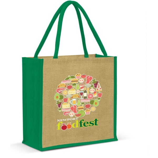 A jute tote bag with green handles, featuring a colourful design and a logo on one side.
