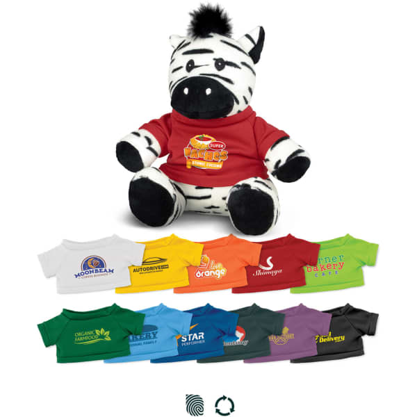 A zebra plush toy wearing a red t-shirt, surrounded by smaller t-shirts in various colours and designs.