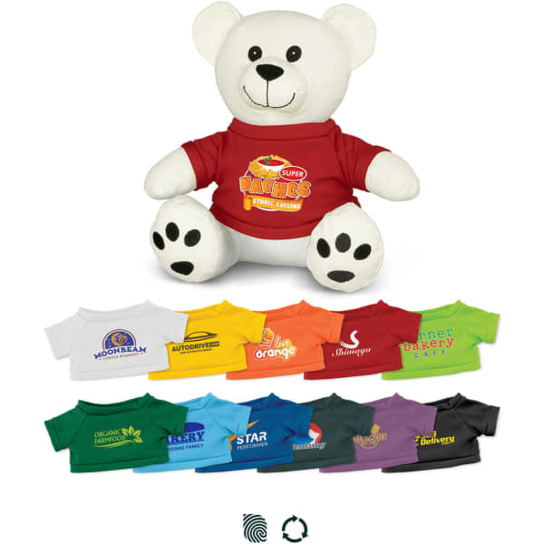 A white plush bear wearing a red shirt, surrounded by other colourful shirts in various shades. The bear has a logo on its shirt.