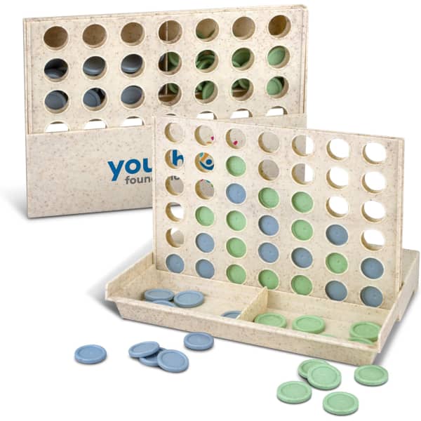 A Four in a Row game set featuring a light-coloured board with blue and green discs scattered around.